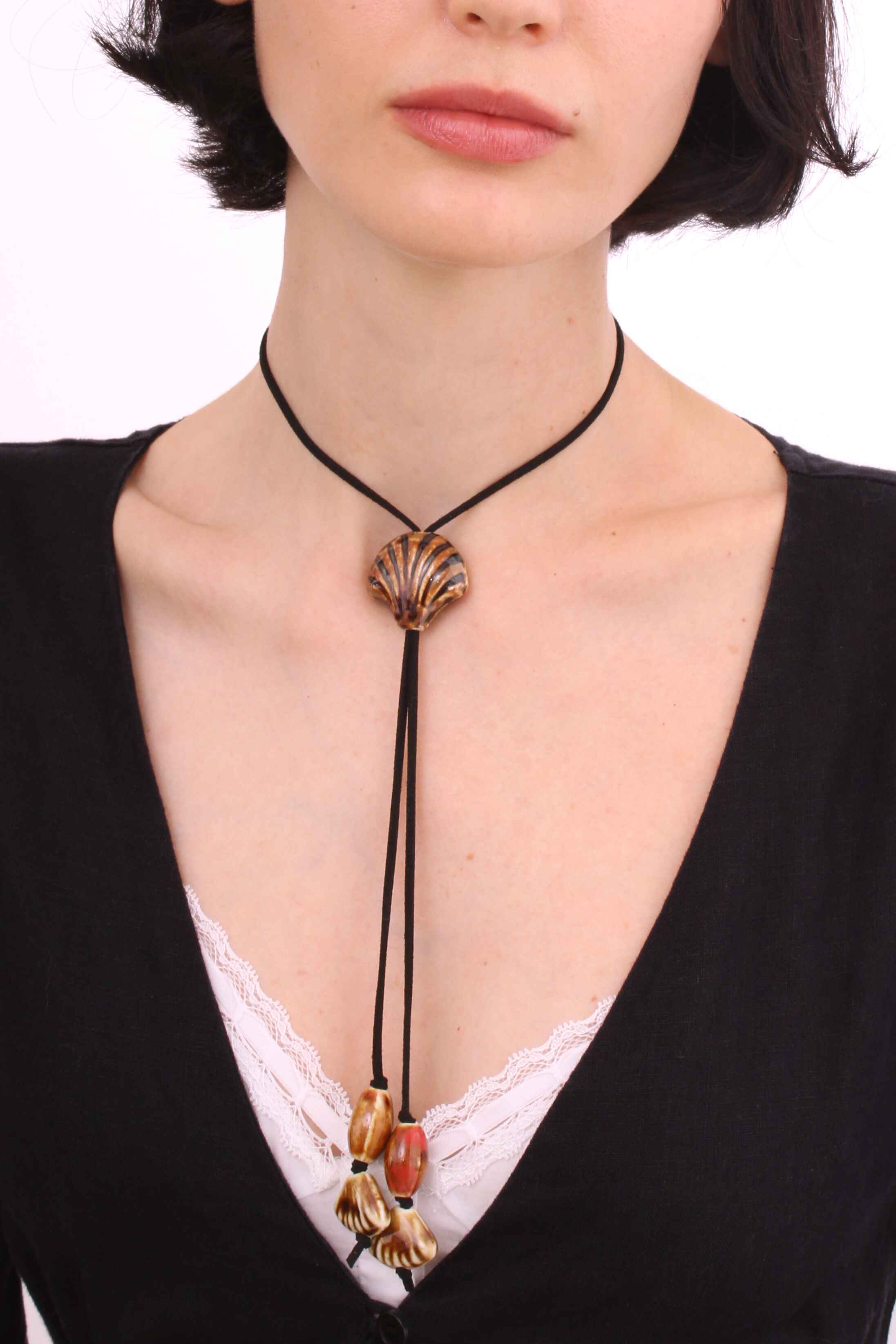 Black Suede Cord Necklace With Ceramic Seashell Tie Charm.