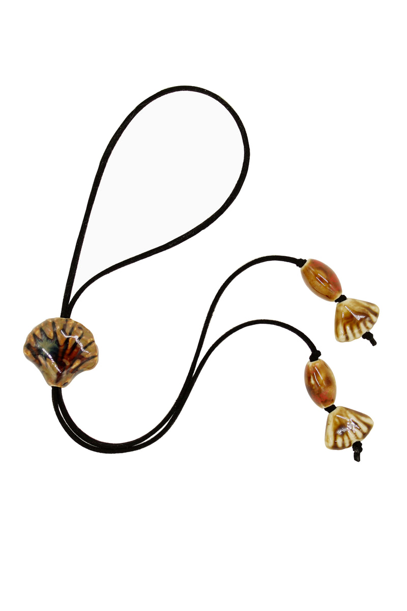 Black Suede Cord Necklace With Ceramic Seashell Tie Charm.